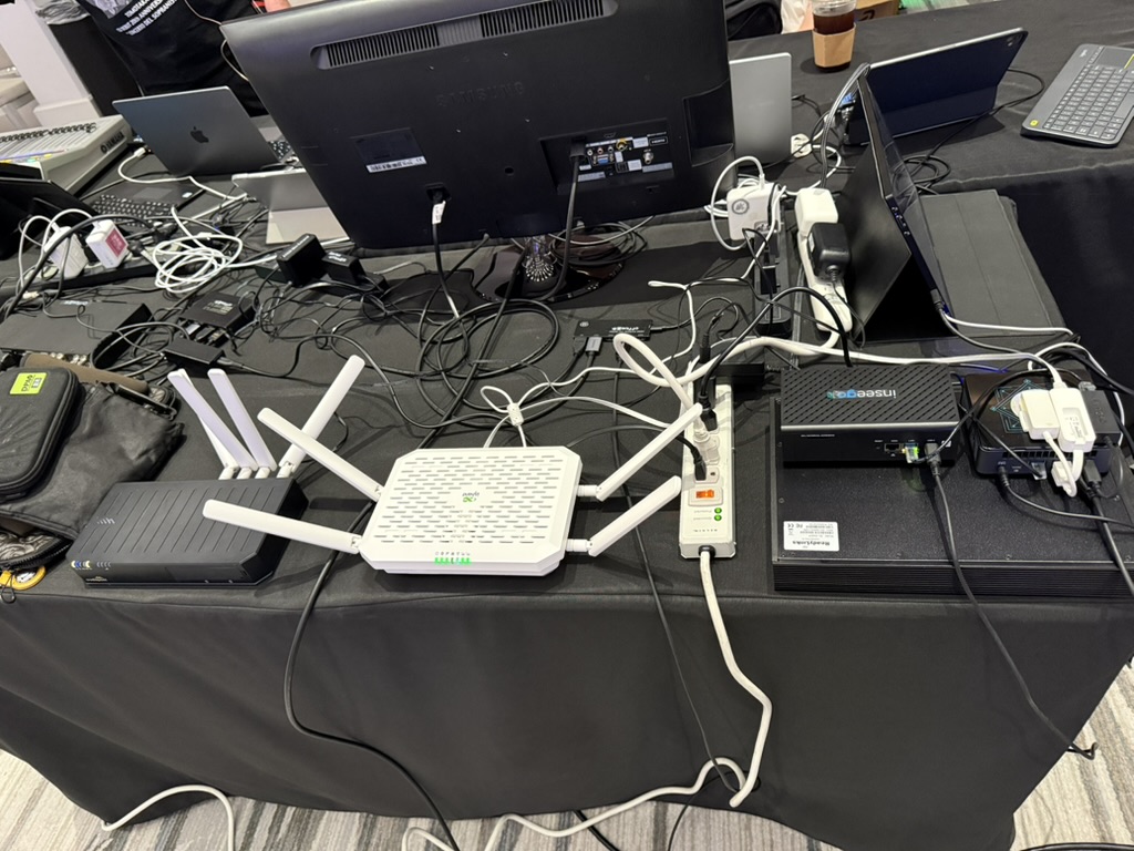 Cradlepoint E320, InHand FWA02, and Inseego FX4100 on a bench during a multi-device 5G test